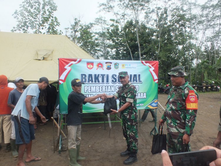 Peduli Warga Kurang Mampu Dalam Wujud Bakti Sosial Untuk Kemanunggalan TNI Bersama Rakyat Dengan Kegiatan Pembagian Sembako